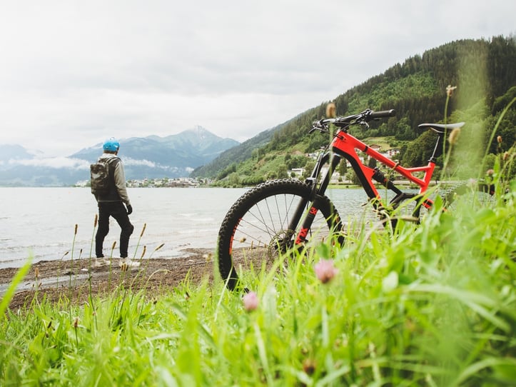 Outdoor biker taking break along side the water