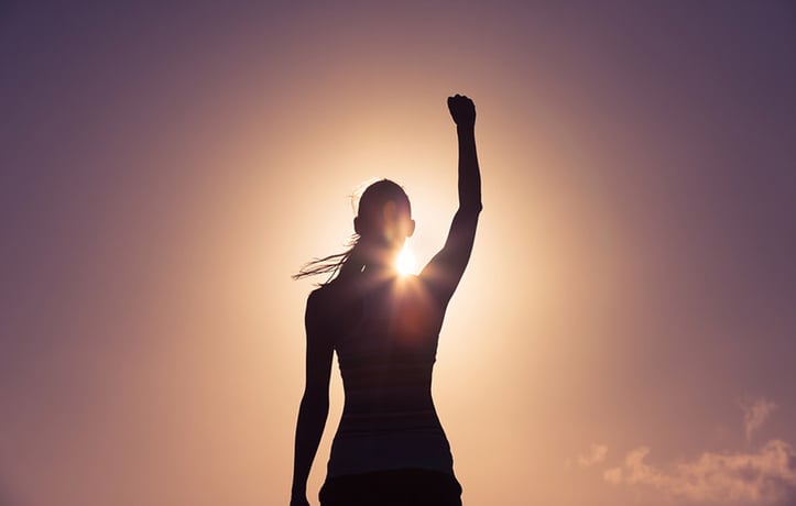 Woman putting her fist in the air