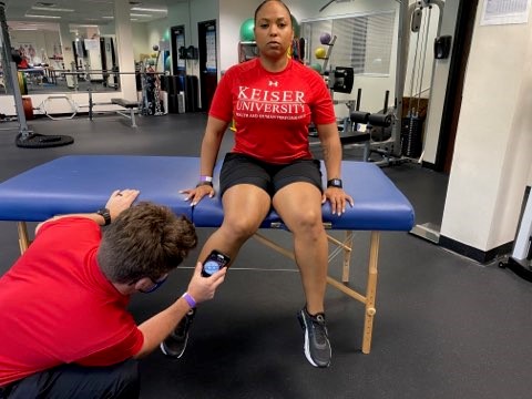 seated active hip rotation with smartphone