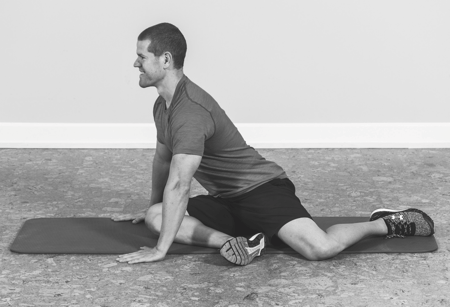 man putting weight on knee to stretch it band