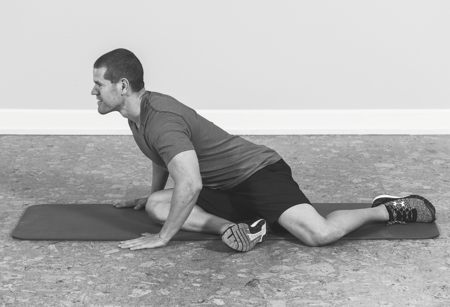 man lengthening spine to stretch it band