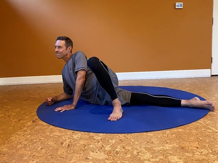 man laying on side to stretch IT band