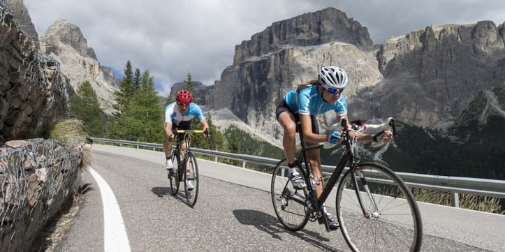 cyclists biking on a road