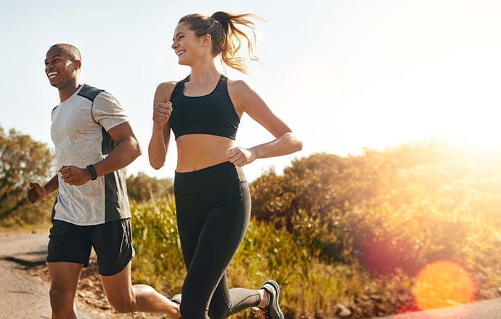 two people boosting their happiness with an outside workout