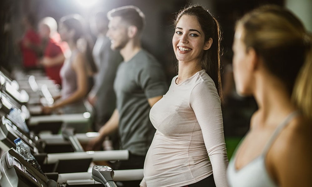 pregnant woman doing cardio on treadmill