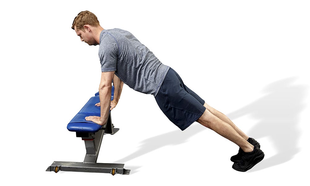 man doing proper pushup form on bench