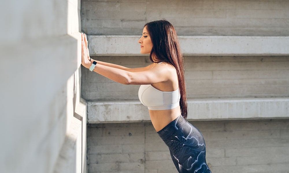 woman doing a wall pushup