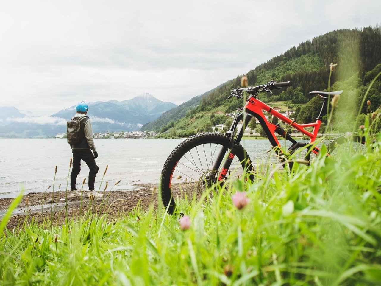 Outdoor biker taking break along side the water