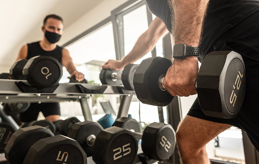 a man doing a drop set in the gym