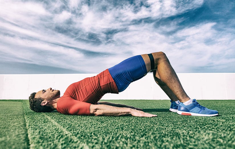 a man training glutes with a resistance band