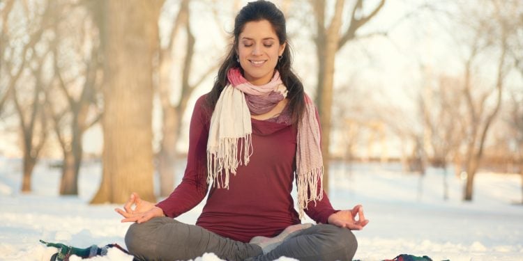 A Woman Meditating In the Park