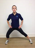 woman doing a standing inner though stretch