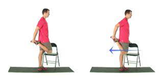 man doing a standing quad stretch