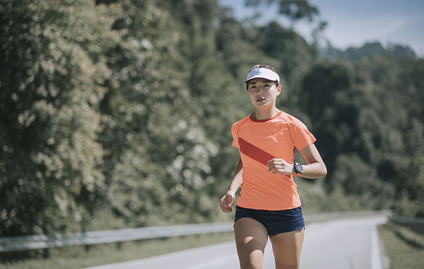 a woman with mental toughness running outside