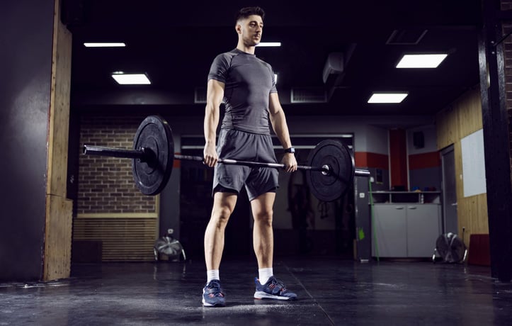A man doing a deadlift in the gym