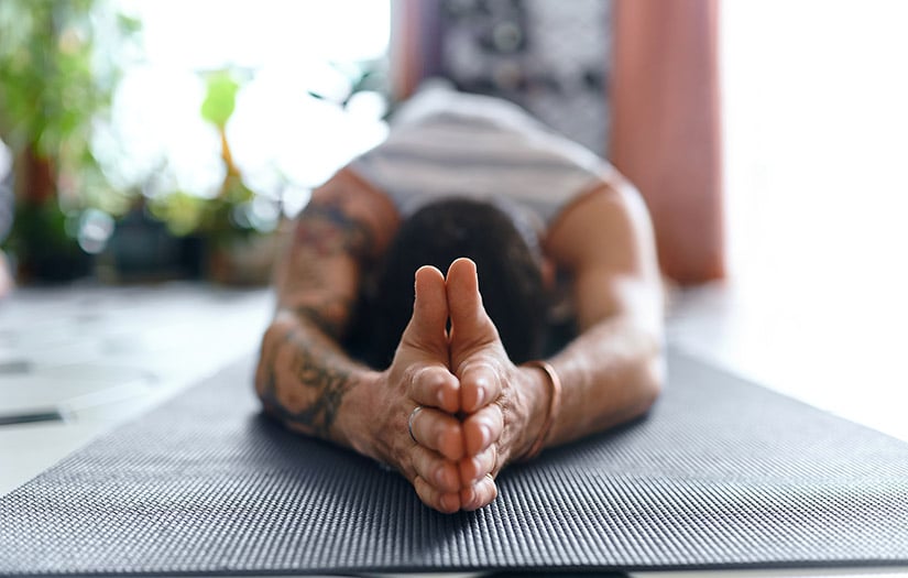man doing child pose